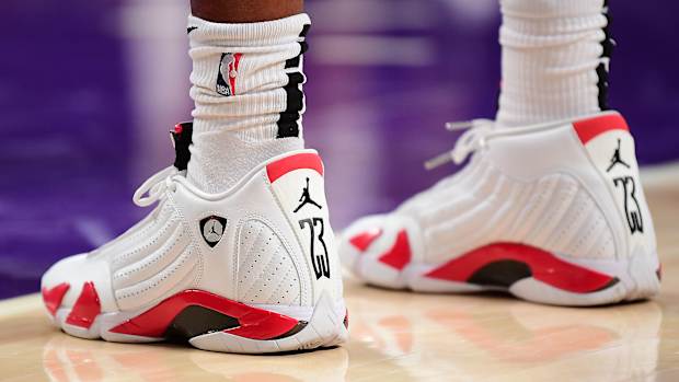 View of white and red Air Jordan sneakers.
